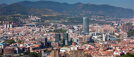 futuristic glass buildings - Aerial view of Bilbao Guggenheim Museum, Iberdrola Tower skyscraper and Red Bridge in Basque country, Spain Stock Photo - Rights-Managed, Code: 841-07523717