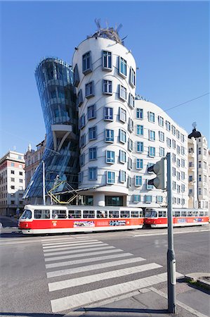 simsearch:841-05846383,k - Tram in front of the Dancing House (Ginger and Fred) by Frank Gehry, Prague, Bohemia, Czech Republic, Europe Stock Photo - Rights-Managed, Code: 841-07540376