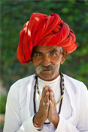 senior friends travel - Traditional Namaste greeting from Indian man with traditional Rajasthani turban in village in Rajasthan, India Stock Photo - Rights-Managed, Code: 841-07540468