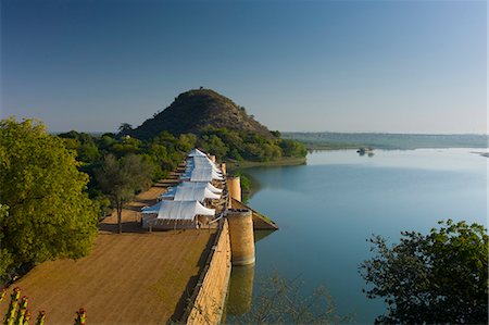 Chhatra Sagar reservoir and luxury tented camp oasis in the desert at Nimaj, Rajasthan, Northern India Stock Photo - Rights-Managed, Code: 841-07540460