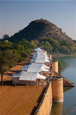 Chhatra Sagar reservoir and luxury tented camp oasis in the desert at Nimaj, Rajasthan, Northern India Stock Photo - Rights-Managed, Code: 841-07540461