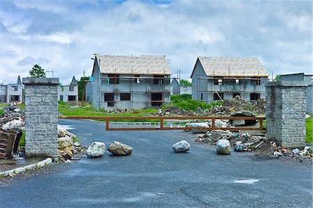 Sign of financial crisis and end of the Celtic Tiger economy,  half-finished new housing at Rathkeale, Co. Limerick, Ireland Stock Photo - Rights-Managed, Code: 841-07540780