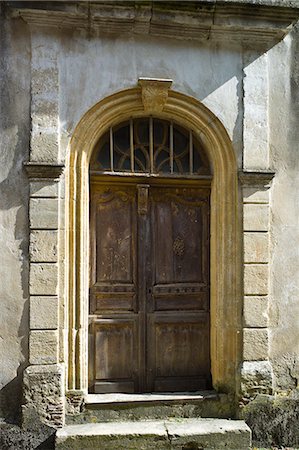 front entrance wooden doors - Traditional French doorway in quaint town of Castelmoron d'Albret in Bordeaux region, Gironde, France Stock Photo - Rights-Managed, Code: 841-07540875