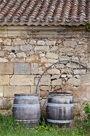 Traditional old wine barrels at a wine chai near St Emilion, Bordeaux, France Stock Photo - Rights-Managed, Code: 841-07540896