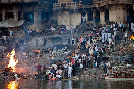 simsearch:841-07083320,k - Body bathed in River Ganges and traditional Hindu cremation on funeral pyre at Manikarnika Ghat in Holy City of Varanasi, Benares, India Stock Photo - Rights-Managed, Code: 841-07589882