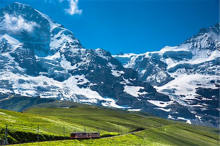 Jungfraubahn funicular train climbs to the Jungfrau from Kleine Scheidegg in the Swiss Alps in Bernese Oberland, Switzerland, Europe Stock Photo - Rights-Managed, Code: 841-07589907