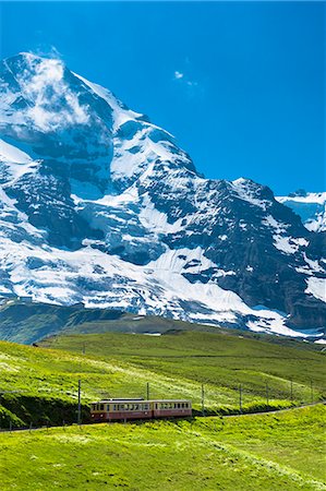simsearch:841-07589928,k - Jungfraubahn funicular train climbs to the Jungfrau from Kleine Scheidegg in the Swiss Alps in Bernese Oberland, Switzerland, Europe Stock Photo - Rights-Managed, Code: 841-07589908