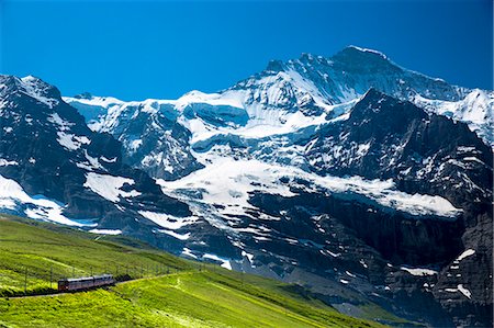 simsearch:841-07589928,k - Jungfraubahn funicular train climbs to the Jungfrau from Kleine Scheidegg in the Swiss Alps in Bernese Oberland, Switzerland, Europe Stock Photo - Rights-Managed, Code: 841-07589909