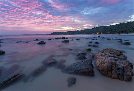 pink beach sunset - Long exposure of a pink sunset at the beach during dusk with rocks in the foreground, Tangalle, Sri Lanka, Asia Photographie de stock - Rights-Managed, Code: 841-07600053