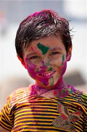 face paint kid - Young Indian boy celebrating annual Hindu Holi festival of colours with powder paints in Mumbai, formerly Bombay, Maharashtra, India Stock Photo - Rights-Managed, Code: 841-07600122