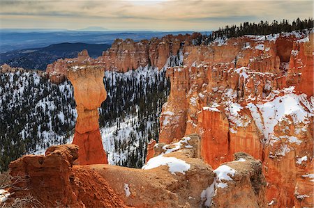 simsearch:6129-09057775,k - Top-heavy hoodoo, pine trees and cliffs with snow and a cloudy sky, Agua Canyon, Bryce Canyon National Park, Utah, United States of America, North America Stock Photo - Rights-Managed, Code: 841-07673354