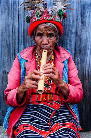 philippines - Traditional dressed Ifugao women playing the flute in Banaue, UNESCO World Heritage Site, Northern Luzon, Philippines, Southeast Asia, Asia Stock Photo - Rights-Managed, Code: 841-07673474