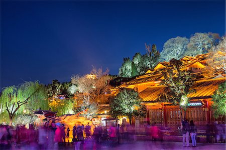 Colourfully illuminated traditional architecture and trees in the old town of Lijiang, UNESCO World Heritage Site, Yunnan province, China, Asia Stock Photo - Rights-Managed, Code: 841-07782067