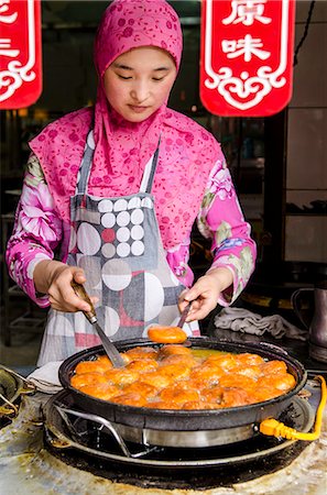 portrait woman cook - Uyghur food in Muslim Quarter market, Guilin, Guangxi, China, Asia Stock Photo - Rights-Managed, Code: 841-07782445