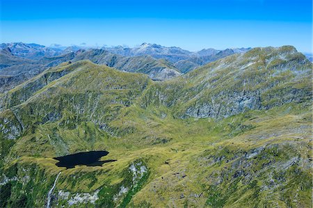 south island new zealand birds eye view - Aerial of the rugged mountains in Fiordland National Park, UNESCO World Heritage Site, South Island, New Zealand, Pacific Stock Photo - Rights-Managed, Code: 841-07782664