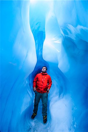 Man standing in an ice cave, Fox Glacier, Westland Tai Poutini National Park, South Island, New Zealand, Pacific Photographie de stock - Rights-Managed, Code: 841-07782689