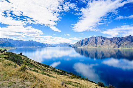 Cloud reflections in Lake Hawea, Haast Pass, South Island, New Zealand, Pacific Photographie de stock - Rights-Managed, Code: 841-07782797