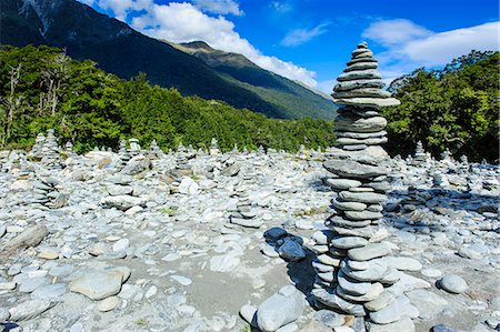 Man made stone pyramids at the Blue Pools, Haast Pass, South Island, New Zealand, Pacific Photographie de stock - Rights-Managed, Code: 841-07782791