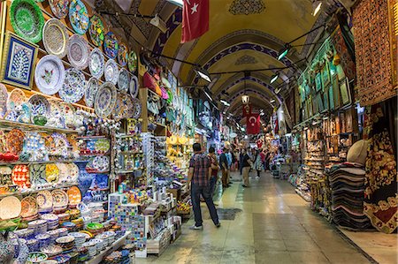 Shops and sellers (vendors) selling Turkish pottery, carpets, kilims, Grand Bazaar, Istanbul, Turkey, Europe Stock Photo - Rights-Managed, Code: 841-07801559