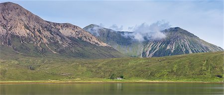 simsearch:841-07913728,k - Small white solitary crofters cottage nestling below mountain range reflected in waters of the loch, Isle of Skye, Inner Hebrides, Highlands and Islands, Scotland, United Kingdom, Europe Stock Photo - Rights-Managed, Code: 841-07913718