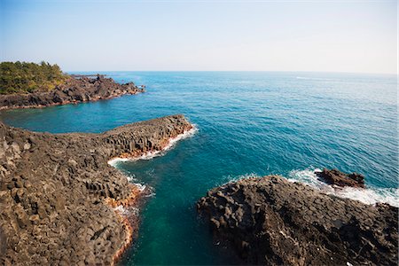 petrified (fossilized) - Jungman Daepo columnar jointed lava formation, Seogwipo, Jeju Island, UNESCO World Heritage Site, South Korea, Asia Stock Photo - Rights-Managed, Code: 841-07913819