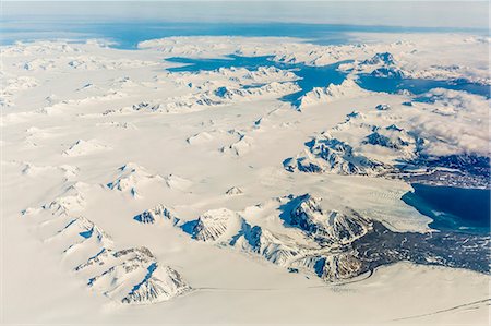 simsearch:6119-07968983,k - Aerial view of mountains, glaciers and ice fields on the west coast of Spitsbergen on a commercial flight from Longyearbyen to Oslo, Svalbard, Norway, Scandinavia, Europe Stock Photo - Rights-Managed, Code: 841-08031376