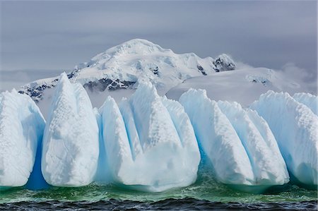 Wind and water sculpted iceberg in Orne Harbor, Antarctica, Polar Regions Stock Photo - Rights-Managed, Code: 841-08101659