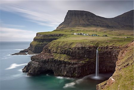 Beautiful coastal scenery beside the village of Gasadalur on the island of Vagar, Faroe Islands, Denmark, Europe Stock Photo - Rights-Managed, Code: 841-08101956