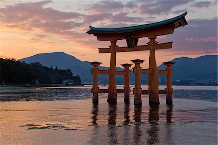 The floating Miyajima torii gate of Itsukushima Shrine at sunset, UNESCO World Heritage Site, Miyajima Island, Western Honshu, Japan, Asia Stock Photo - Rights-Managed, Code: 841-08102266