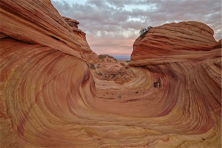 Red and yellow sandstone wave channel, Coyote Buttes Wilderness, Vermilion Cliffs National Monument, Arizona, United States of America, North America Stock Photo - Rights-Managed, Code: 841-08211645
