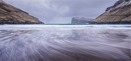 Waves crash against the black sandy beach at Tjornuvik on the island of Streymoy, Faroe Islands, Denmark, Europe Stock Photo - Rights-Managed, Code: 841-08211713