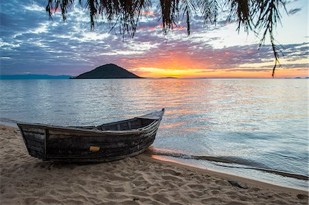 simsearch:841-02712624,k - Fishing boat at sunset at Cape Malcear, Lake Malawi, Malawi, Africa Stock Photo - Rights-Managed, Code: 841-08220888