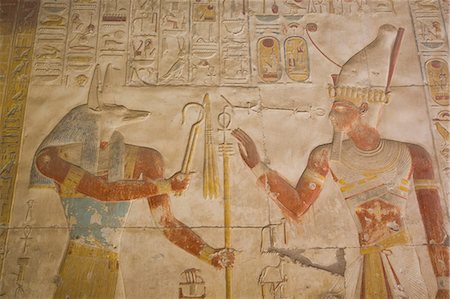 simsearch:6119-07452833,k - Bas-relief of the God Anubis on left and Ramses II on right, Temple of Seti I, Abydos, Egypt, North Africa, Africa Stock Photo - Rights-Managed, Code: 841-08220995