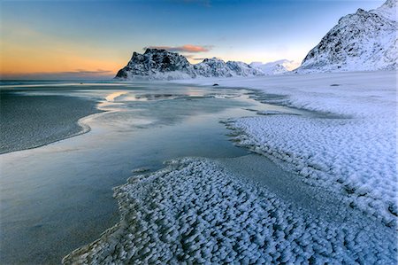 snow texture - Dawn illuminates the beach covered with frozen snow in the cold sea of Uttakleiv, Lofoten Islands, Arctic, Norway, Scandinavia, Europe Stock Photo - Rights-Managed, Code: 841-08244009