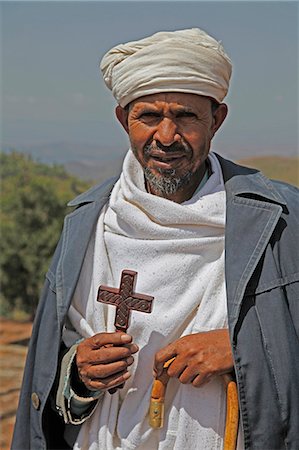 Orthodox priest hold cross at the ancient sunken rock-hewn church of St. George in Lalibela, Ethiopia, Africa Photographie de stock - Rights-Managed, Code: 841-08240001