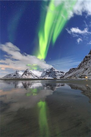 Northern Lights (aurora borealis) and mountains reflected in the cold waters, Skagsanden, Lofoten Islands, Arctic, Norway, Scandinavia, Europe Stock Photo - Rights-Managed, Code: 841-08243976