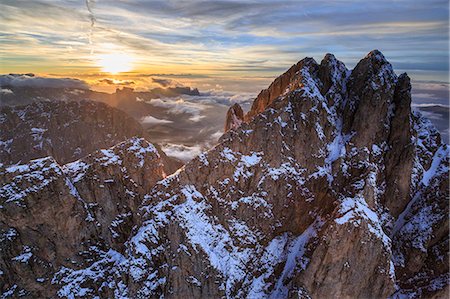 Aerial shot of Sassolungo at sunset, Sella Group, Val Gardena in the Dolomites, Val Funes, Trentino-Alto Adige South Tyrol, Italy, Europe Stock Photo - Rights-Managed, Code: 841-08243993