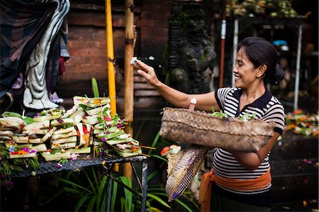 simsearch:841-03870667,k - A lady gives her daily offering in Bali, Indonesia, Southeast Asia, Asia Stock Photo - Rights-Managed, Code: 841-08279153