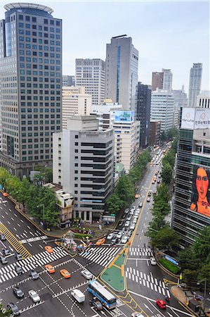 Elevated view of a busy city centre street and high rise buildings on a rainy summer day, City Hall area, Seoul, South Korea, Asia Stock Photo - Rights-Managed, Code: 841-08357330