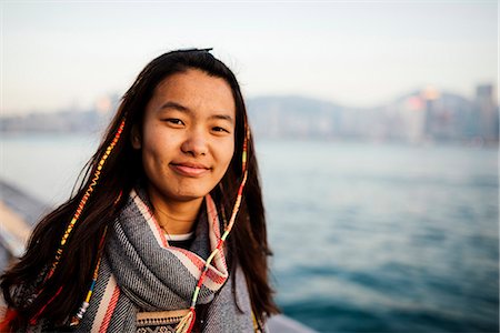 Portrait of young woman, Avenue of Stars, Tsim Sha Tsui Waterfront, Kowloon, Hong Kong, China, Asia Foto de stock - Con derechos protegidos, Código: 841-08357752