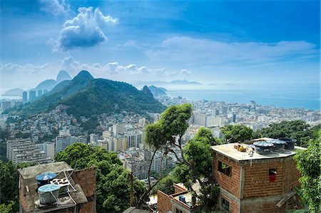 Rio de Janeiro from Cabritos favela in Copacabana, Moro Sao Joao and Sugar Loaf in the foreground, Copacabana right of frame, Rio de Janeiro, Brazil, South America Stock Photo - Rights-Managed, Code: 841-08542463