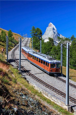 The swiss Bahn train runs on its route with the Matterhorn in the background, Gornergrat, Canton of Valais, Swiss Alps, Switzerland, Europe Stock Photo - Rights-Managed, Code: 841-08542492