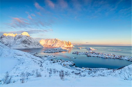 reine norway snow - The colors of dawn frame the fishing villages surrounded by snowy peaks, Reine, Nordland, Lofoten Islands, Arctic, Norway, Scandinavia, Europe Stock Photo - Rights-Managed, Code: 841-08663473