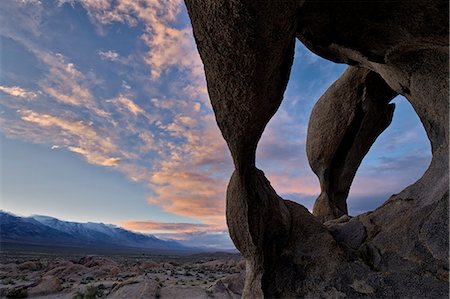 scenic california not people - Sunset through Cyclops' Skull Arch, Alabama Hills, Inyo National Forest, California, United States of America, North America Photographie de stock - Rights-Managed, Code: 841-08663665