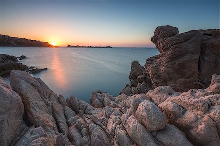 White cliffs and blue sea framed by the lights of sunset Santa Teresa di Gallura, Province of Sassari, Sardinia, Italy, Mediterranean, Europe Stock Photo - Rights-Managed, Code: 841-08781733