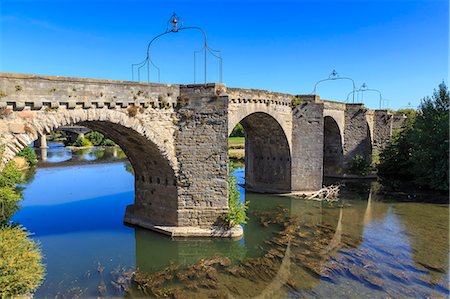The 14th century medieval bridge Pont-Vieux, over River Aude, Ville Basse, Carcassonne, Languedoc-Roussillon, France, Europe Stock Photo - Rights-Managed, Code: 841-08797744