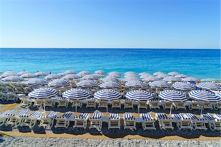 Blue and white beach parasols, Nice, Alpes-Maritimes, Cote d'Azur, Provence, French Riviera, France, Mediterranean, Europe Stock Photo - Rights-Managed, Code: 841-08887320