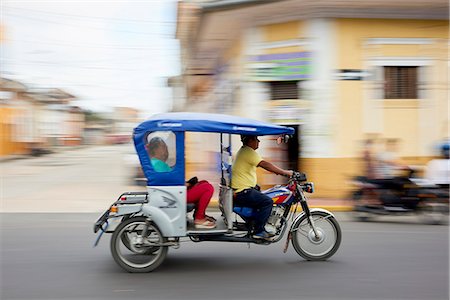 Panned shot of mototaxi in Iquitos, Peru, South America Stock Photo - Rights-Managed, Code: 841-09055368