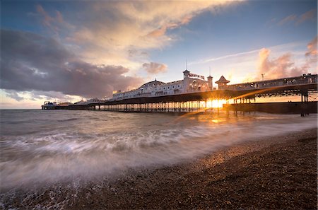 dock, sunset - Brighton Pier at sunset with dramatic sky and waves washing up the beach, Brighton, East Sussex, England, United Kingdom, Europe Stock Photo - Rights-Managed, Code: 841-09059946