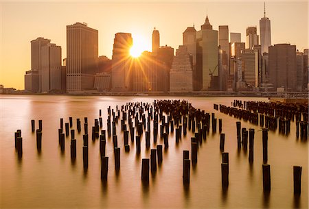 simsearch:841-09086037,k - Lower Manhattan skyline, New York skyline, exposed wooden pier stumps, at sunset, East River, New York, United States of America, North America Stock Photo - Rights-Managed, Code: 841-09059974